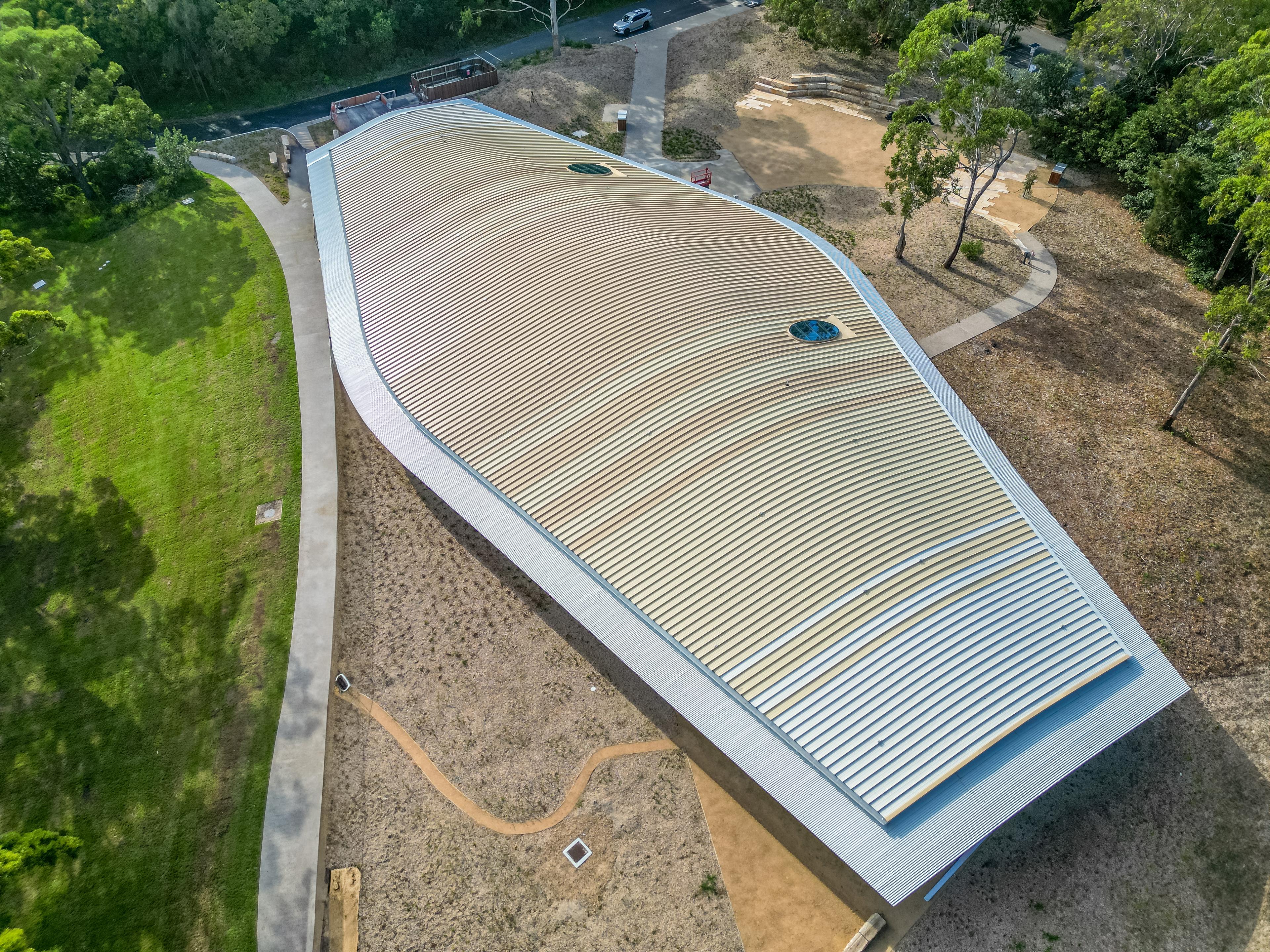 Aerial view of a curved metal roof